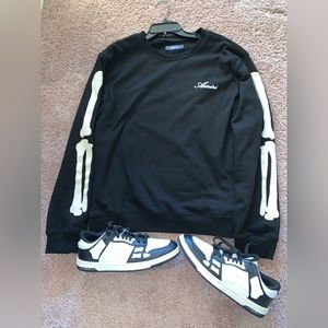 Amiri bone sweater and low top sneakers